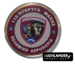 Commemorative coin with the emblem of 110 Combat Wing, featuring a helmeted warrior and fist, Greek motto, and Hellenic Air Force markings.