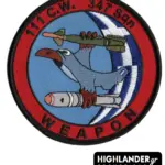 Embroidered patch with blue hawk holding missile and bomb, blue background, HAF roundel, red border, "111 C.W. 347 Sqn WEAPON" text.
