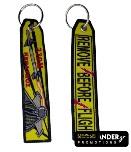 Double-sided embroidered keychain with F-16 jet, "330M KERAVNOS", missile, and "REMOVE BEFORE FLIGHT" with red lightning bolt.