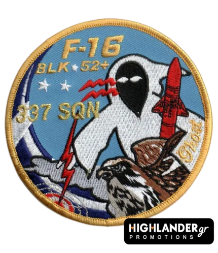Embroidered patch with ghost figure, red missile, hawk, blue background, gold "F-16 BLK 52+" and "337 SQN" text, and gold border.