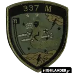 Low visibility embroidered patch with ghost riding two missiles, stars, clouds, lightning, "337 M" and "11" insignia, olive and sand colors.