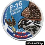 Embroidered round patch with hawk head, winged sword, blue background, Greek key pattern, "F-16 Fighting Falcon" text, and red "347 Μ ΠΕΡΣΕΑΣ" inscription.