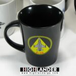 Black ceramic mug with yellow F-16 emblem and red lettering, Hellenic Air Force.