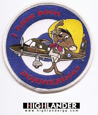 Embroidered patch with cartoon mouse in yellow sombrero saluting in front of Dornier Do-28, blue and white HAF roundel, red "I have been DORNIERistas" text.