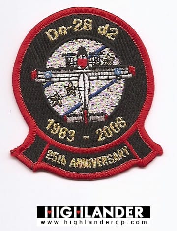 Embroidered patch with front-view Dornier Do-28 d2, globe, laurel branches, Acropolis, gold "1983 – 2008" and "25th Anniversary" text, red border.