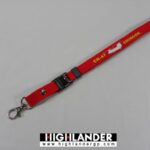Red lanyard with white CH-47 Chinook helicopter silhouette and yellow "CH-47 CHINOOK" text, metal clasp and detachable buckle.