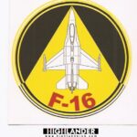 Round sticker with white F-16 jet top view, yellow and black triangle background, and red "F-16" text.