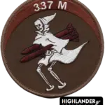 Brown embroidered patch with white ghost in cloak riding two red missiles, “337 M” inscription at top