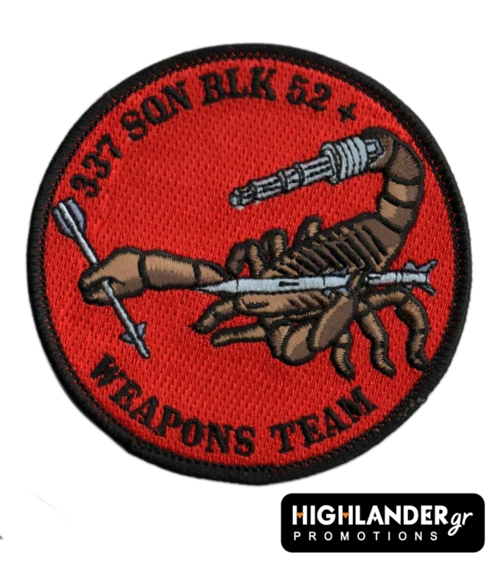 Embroidered patch with brown scorpion holding a grey missile and machine gun, red background, black border, “337 SQN BLK 52+ WEAPONS TEAM” text.