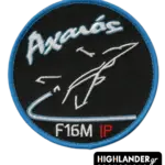 Axaios F-16M instructor pilot patch—Greek Air Force badge with call sign "Αχαιός," stylized F-16 jet, blue trim, and red IP letters.