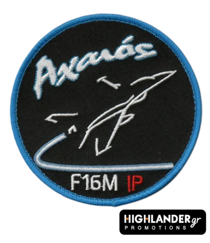 Axaios F-16M instructor pilot patch—Greek Air Force badge with call sign "Αχαιός," stylized F-16 jet, blue trim, and red IP letters.