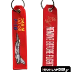 Red embroidered keychain for HAF 346 Squadron. Side A: "346 M IASON F-16" text with jet embroidery. Side B: "REMOVE BEFORE FLIGHT" with golden helmet emblem.