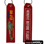 Red embroidered keychain for AB-212 ASW helicopter. Side A shows the helicopter and text. Side B shows "REMOVE BEFORE FLIGHT" in white text.