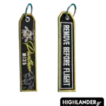 Black embroidered keychain with gold border showing Mi-35 helicopter and Panthers text on one side, and REMOVE BEFORE FLIGHT on the other.