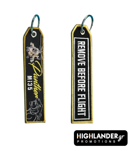 Black embroidered keychain with gold border showing Mi-35 helicopter and Panthers text on one side, and REMOVE BEFORE FLIGHT on the other.