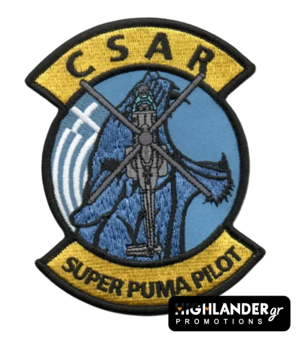 Embroidered aviation patch with yellow top and bottom tabs reading "CSAR" and "SUPER PUMA PILOT". The center shows a blue background with a Super Puma helicopter silhouette.