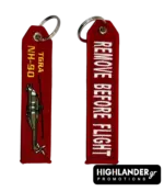 Red embroidered keychain for NH-90 TGRA helicopter from Highlander Promotions. Side A shows the helicopter graphic and yellow text. Side B shows "REMOVE BEFORE FLIGHT".