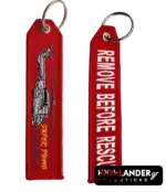 Red embroidered keychain for the AS-332L-1 Super Puma. Side A shows a red helicopter silhouette and yellow model text; Side B shows white "Remove Before Flight" text.