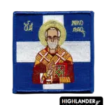 Square embroidered morale patch showing Saint Nicholas holding a Gospel book against a blue and white Greek flag background.