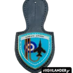 A navy blue leather badge holder featuring the 117 Combat Wing enamel crest with the Greek motto "Exthrous Amynou", a black fighter jet silhouette, and the HAF roundel.