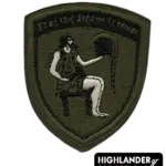Shield-shaped (Crest) olive drab tactical patch for the Military Factories Command (DISE) featuring Hephaestus and the motto Ekastos Eideii Technin.