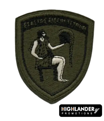 Shield-shaped (Crest) olive drab tactical patch for the Military Factories Command (DISE) featuring Hephaestus and the motto Ekastos Eideii Technin.