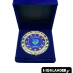 Gold-tone commemorative medallion of EUNAVFOR Operation ASPIDES featuring the blue shield logo and 12 stars, displayed in a blue velvet box.