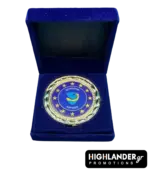 Gold-tone commemorative medallion of EUNAVFOR Operation ASPIDES featuring the blue shield logo and 12 stars, displayed in a blue velvet box.