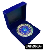 Gold-tone commemorative medallion of EUNAVFOR Operation ASPIDES featuring the blue shield logo and 12 stars, displayed in a blue velvet box.