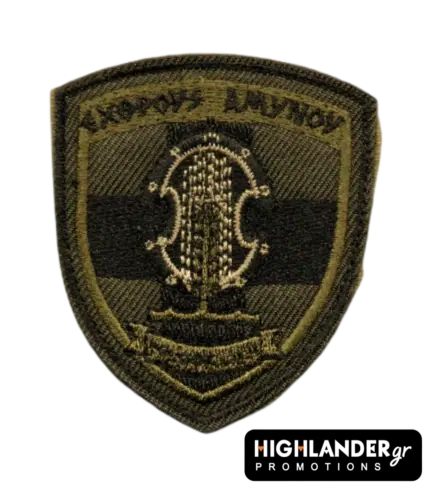 Shield-shaped olive drab tactical patch for the Hellenic National Guard with embroidered shield, spear, and motto "EXTHROUS AMYNOU".