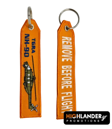 Orange embroidered keychain for NH-90 TGRA helicopter from Highlander Promotions. Side A shows the helicopter graphic and yellow text. Side B shows "REMOVE BEFORE FLIGHT".