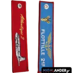 Double-sided fabric keychain featuring the Atlantique 2 aircraft on a red background and Flottille 21F insignia on a blue background.