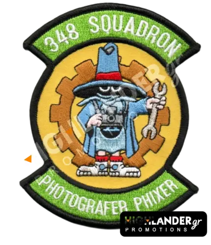 Morale patch for the 348 Squadron featuring the "Spook" mascot in blue holding a camera and wrench, with "348 SQUADRON" and "PHOTOGRAFER PHIXER" text.