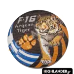 Dual-sided metal challenge coin: one side shows an eagle head with "F-16 Fighting Falcon", the other features a tiger with "F-16 Aegean Tiger" and a paw print.