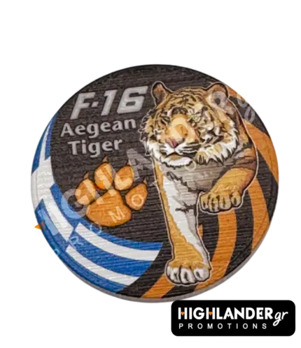 Dual-sided metal challenge coin: one side shows an eagle head with "F-16 Fighting Falcon", the other features a tiger with "F-16 Aegean Tiger" and a paw print.