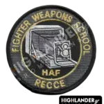 Round embroidered morale patch for the Hellenic Air Force Fighter Weapons School reconnaissance division, featuring an aerial camera and the text "FIGHTER WEAPONS SCHOOL HAF RECCE".