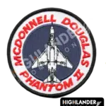 Round embroidered patch featuring the silhouette of the McDonnell Douglas Phantom II aircraft on a dark blue background, with red text.