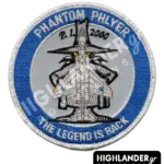 Round blue and grey embroidered military morale patch featuring the F-4 Spook mascot opening his cloak to reveal a Phantom jet silhouette.