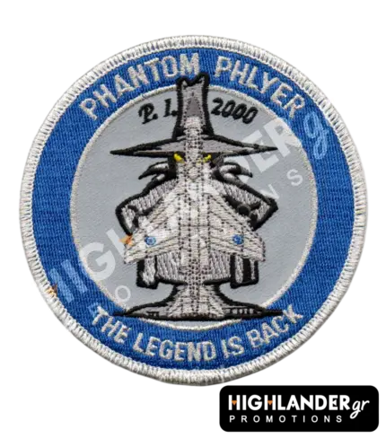 Round blue and grey embroidered military morale patch featuring the F-4 Spook mascot opening his cloak to reveal a Phantom jet silhouette.