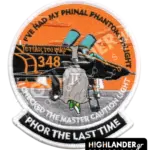Round embroidered military patch featuring the F-4 Spook mascot walking away from a HAF 348 Squadron Phantom jet under an orange sky