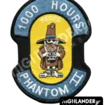Shaped embroidered flight patch for 1000 hours in Recce Phantoms, featuring a brown Spook mascot with a camera, on a yellow and blue background.
