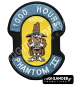 Shaped embroidered flight patch for 1000 hours in Recce Phantoms, featuring a brown Spook mascot with a camera, on a yellow and blue background.