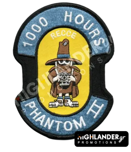 Shaped embroidered flight patch for 1000 hours in Recce Phantoms, featuring a brown Spook mascot with a camera, on a yellow and blue background.