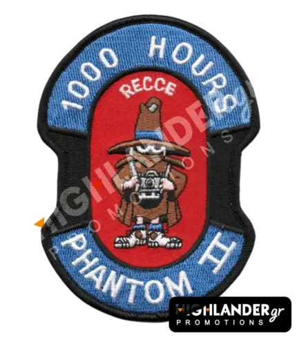 Shaped embroidered flight patch for 1000 hours in Recce Phantoms, featuring a blue Spook mascot with a camera, on a red and blue background.