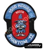 Shaped embroidered flight patch for 1500 hours in Recce Phantoms, featuring a blue Spook mascot with a camera, on a red and blue background.