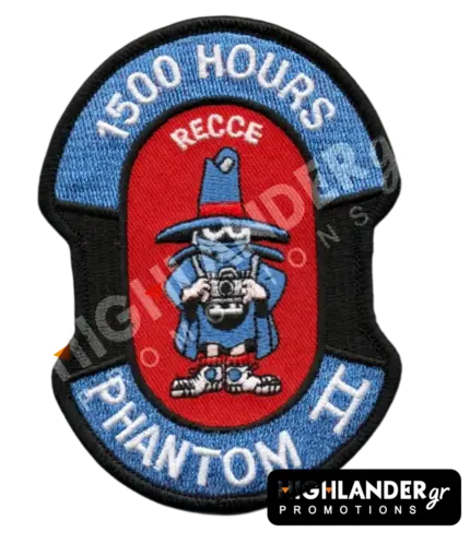 Shaped embroidered flight patch for 1500 hours in Recce Phantoms, featuring a blue Spook mascot with a camera, on a red and blue background.