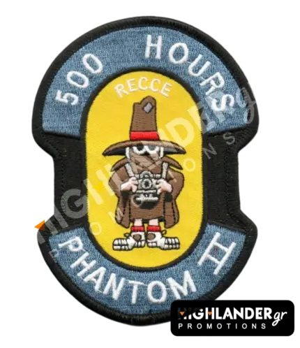 Shaped embroidered flight patch for 500 hours in Recce Phantoms, featuring a brown Spook mascot with a camera, on a yellow and blue background.